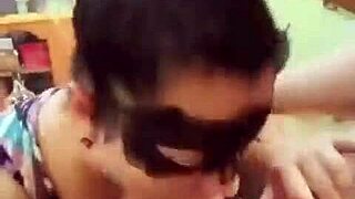 masked woman performs deepthroat blowjob intensely