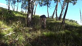 In the forest, girlfriend fucks MILF doggystyle with dildo, shaking big ass in panties