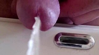 pissing in the sink with a detailed closeup view
