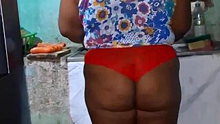 In the kitchen, the believer slut teases with her big tits.