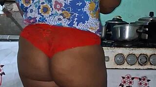 In the kitchen, the believer slut teases with her big tits.