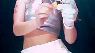 Bonneyuwu drinks from a bottle in a skirt