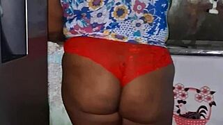 In the kitchen, the believer slut teases with her big tits.