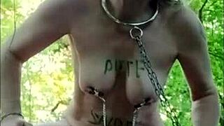 housewife slave bent over in forest for maledom session