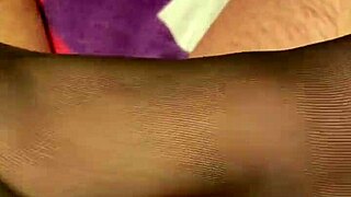 giving the hubby a steamy footjob in black stockings