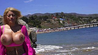 amber alena flaunts huge boobs on the beach for sneaky voyeur eyes