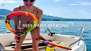 Beautiful housewife washes boat in sexy thong swimsuit outdoors