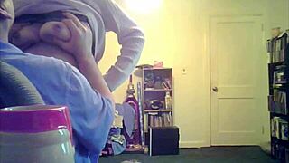 brunette milf loris shows off her tits in the living room