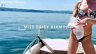 Beautiful housewife washes boat in sexy thong swimsuit outdoors