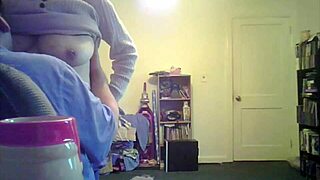 brunette milf loris shows off her tits in the living room