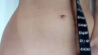 Punishing myself lightly with a belt, exposing tits and pussy