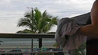 showing my ass on the balcony flashing skirt