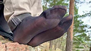 Teasing Close-Up of Beautiful Nylon Feet in Jeans Outdoors