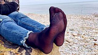 Teasing Close-Up of Beautiful Nylon Feet in Jeans Outdoors