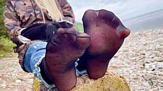 Teasing Close-Up of Beautiful Nylon Feet in Jeans Outdoors