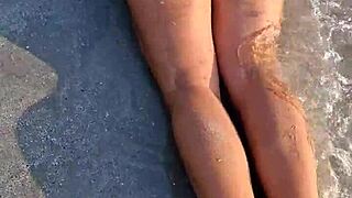 girl flashes in bikini on beach