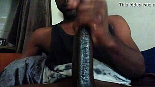 darkness of a huge black cock in close-up view