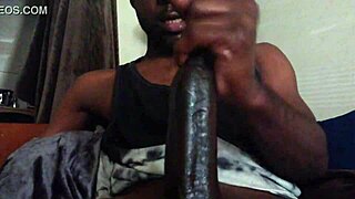 darkness of a huge black cock in close-up view