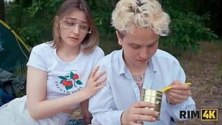 two girls share outdoor camping cleanup