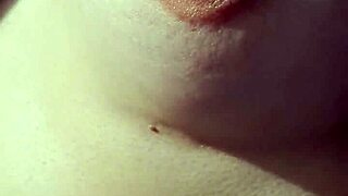 Amateurs explore braless nipples in a casual, intimate setting.