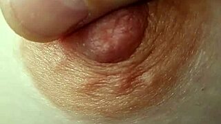 Amateurs explore braless nipples in a casual, intimate setting.