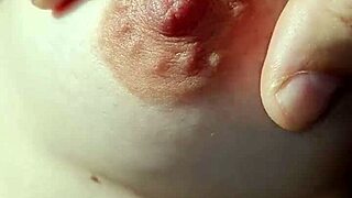 Amateurs explore braless nipples in a casual, intimate setting.