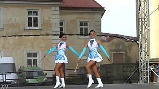 two nice majorettes performing cheerleading routines
