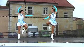 two nice majorettes performing cheerleading routines