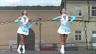 two nice majorettes performing cheerleading routines