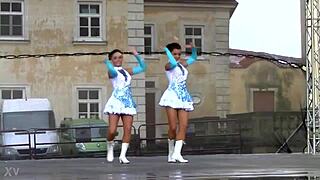 two nice majorettes performing cheerleading routines