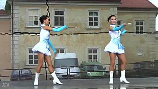 two nice majorettes performing cheerleading routines