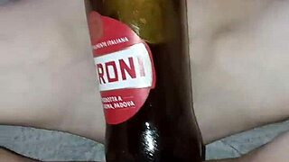 pregnant gretala rubs bottle on pussy