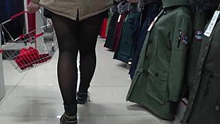 A hidden camera spies on juicy pawg legs in a public mall fitting room.