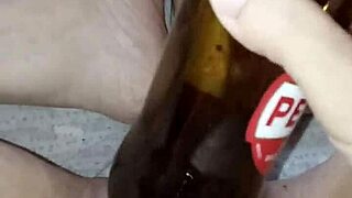 pregnant gretala rubs bottle on pussy