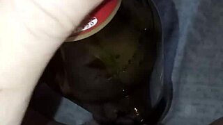 pregnant gretala rubs bottle on pussy