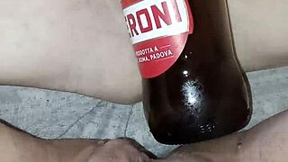 pregnant gretala rubs bottle on pussy