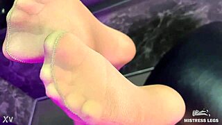 beautiful mistress teases with feet and ass in pantyhose, close up view