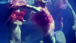 Lilia Mihalkova and Natalia Kupalka as underwater lesbians in tight swimwear
