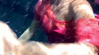 Lilia Mihalkova and Natalia Kupalka as underwater lesbians in tight swimwear