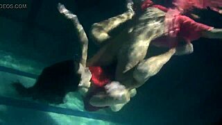 Lilia Mihalkova and Natalia Kupalka as underwater lesbians in tight swimwear