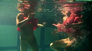 Lilia Mihalkova and Natalia Kupalka as underwater lesbians in tight swimwear