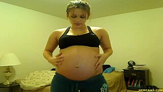 Pregnant Tori Taylor relaxes in blue shorts on webcam
