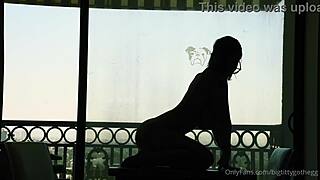 bigtittygothegg rides her dildo in silhouette, showing off shaved pussy