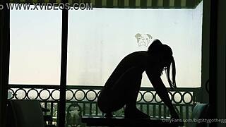 bigtittygothegg rides her dildo in silhouette, showing off shaved pussy