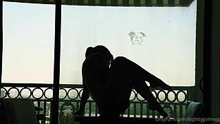 bigtittygothegg rides her dildo in silhouette, showing off shaved pussy