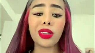 This black babe is having fun with her toys.