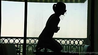 bigtittygothegg rides her dildo in silhouette, showing off shaved pussy