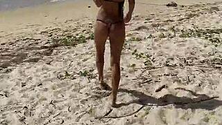 monika fox poses in pink bikini on beach