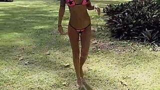 monika fox poses in pink bikini on beach