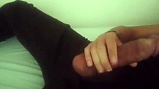 Horny guy in black pants moaning and jerking off his big cock after work until he cums